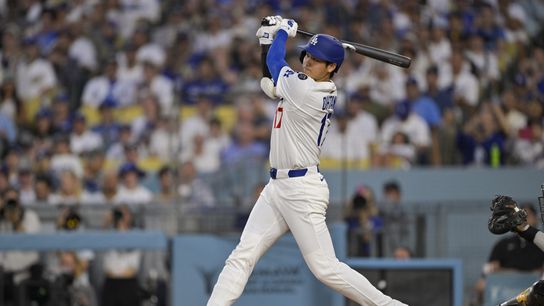 Los Angeles Dodgers designated hitter Shohei Ohtani (17) hits a single during the fourth inning against the San Diego Padres at Dodger Stadium. 