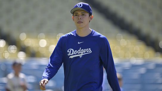 Los Angeles Dodgers starting pitcher Roki Sasaki (11) walks on the field prior to the game against the Los Angeles Dodgers at Dodger Stadium. 