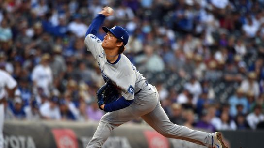 Los Angeles Dodgers pitcher Yoshinobu Yamamoto (18) throws during the first inning against the Colorado Rockies at Coors Field. 