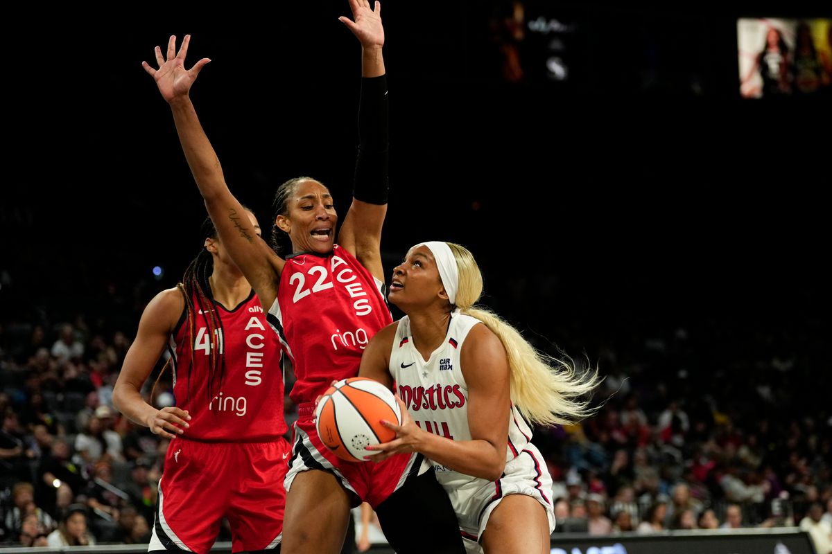 Jun 26, 2025; Las Vegas, Nevada, USA; Washington Mystics forward Kiki Iriafen (44) attempts to score a layup against Las Vegas Aces center A'ja Wilson (22) during the second half of a WNBA basketball game at Michelob Ultra Arena. Jun 26, 2025; Las Vegas, Nevada, USA; Washington Mystics forward Kiki Iriafen (44) attempts to score a layup against Las Vegas Aces center A'ja Wilson (22) during the second half of a WNBA basketball game at Michelob Ultra Arena.