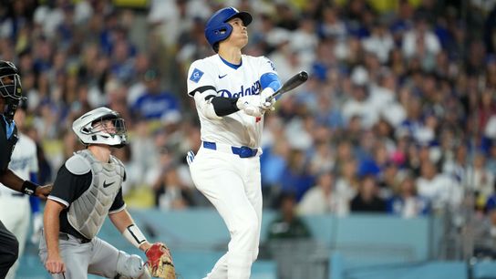Los Angeles Dodgers designated hitter Shohei Ohtani (17) hits a home run ihe fourth inning as Chicago White Sox catcher Kyle Teel (8) watches at Dodger Stadium. 