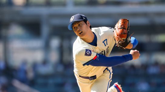 Los Angeles Dodgers two-way player Shohei Ohtani (17) throws to the plate during the first inning against the Houston Astros at Dodger Stadium. 