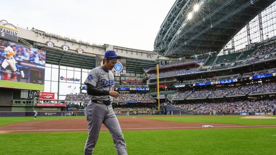 Los Angeles Dodgers designated hitter Shohei Ohtani (17) walks to the dugout after warming up prior to the game against the Milwaukee Brewers at American Family Field. Los Angeles Dodgers designated hitter Shohei Ohtani (17) walks to the dugout after warming up prior to the game against the Milwaukee Brewers at American Family Field.