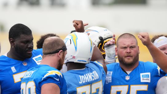 Los Angeles Chargers offensive linemen huddle at training camp at The Bolt.