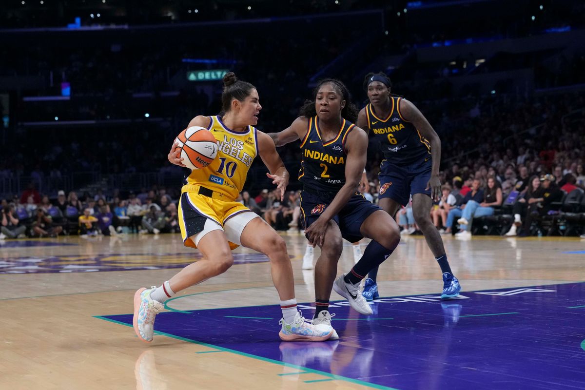 Aug 5, 2025; Los Angeles, California, USA; LA Sparks guard Kelsey Plum (10) drives to the basket while defended by Indiana Fever guard Aari McDonald (2) in the first half at Crypto.com Arena. Aug 5, 2025; Los Angeles, California, USA; LA Sparks guard Kelsey Plum (10) drives to the basket while defended by Indiana Fever guard Aari McDonald (2) in the first half at Crypto.com Arena.