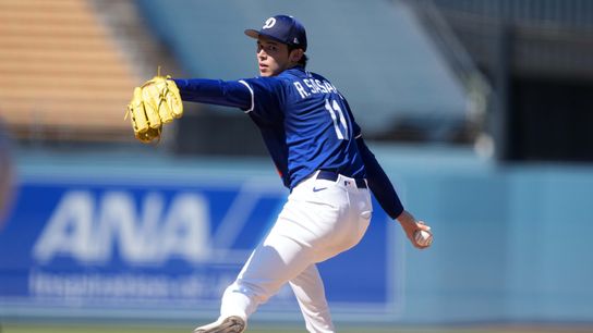 Los Angeles Dodgers pitcher Roki Sasaki (11) throws before the game against the Toronto Blue Jays at Dodger Stadium. 