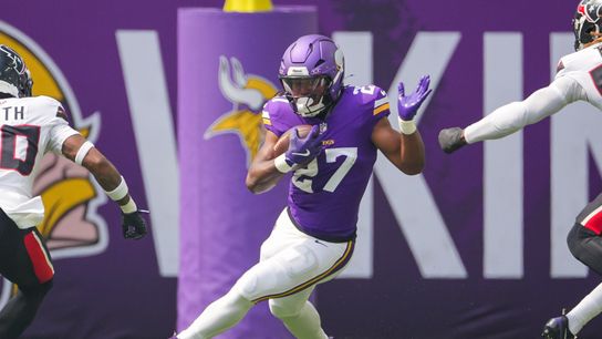 Aug 9, 2025; Minneapolis, Minnesota, USA; Minnesota Vikings running back Jordan Mason (27) runs with the ball against the Houston Texans in the first quarter at U.S. Bank Stadium.