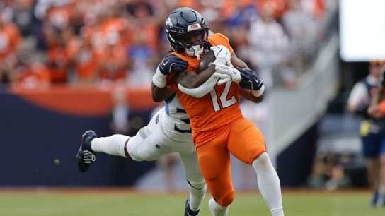 Sep 7, 2025; Denver, Colorado, USA; Denver Broncos running back RJ Harvey (12) rushes the ball against the Tennessee Titans in the second half at Empower Field at Mile High.
