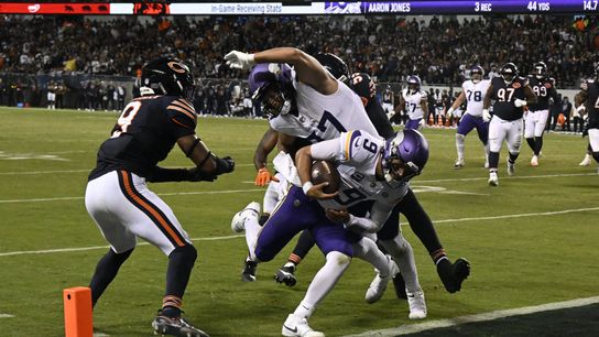 Sep 8, 2025; Chicago, Illinois, USA; Minnesota Vikings quarterback J.J. McCarthy (9) rushes for a touchdown against the Chicago Bears during the second half at Soldier Field.