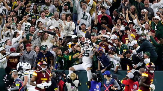 Green Bay Packers fans cheer after tight end Tucker Kraft does a Lambeau Leap during a game against the Washington Commanders on Sept. 11, 2025, at Lambeau Field in Green Bay, Wis. The Packers defeated the Commanders 27-18.