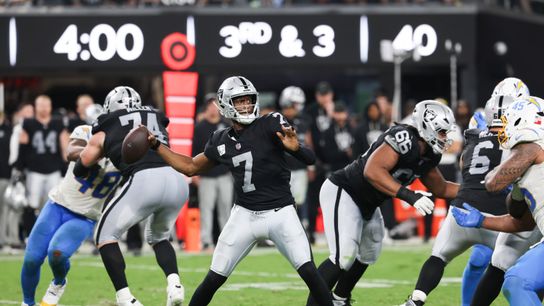 Sep 15, 2025; Paradise, Nevada, USA; Las Vegas Raiders quarterback Geno Smith (7) drops back to pass during the third quarter against the Los Angeles Chargers at Allegiant Stadium.