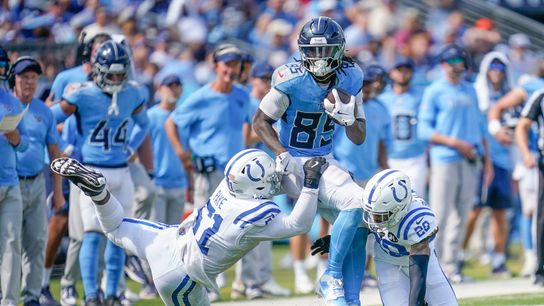 Indianapolis Colts defensive end Kwity Paye (51) and cornerback Mekhi Blackmon (29) stop Tennessee Titans tight end Chig Okonkwo (85) during the third quarter at Nissan Stadium in Nashville, Tenn., Sunday, Sept. 21, 2025.