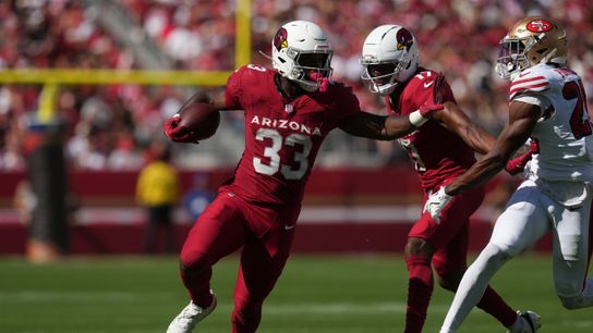Sep 21, 2025; Santa Clara, California, USA; Arizona Cardinals running back Trey Benson (33) carries the ball as San Francisco 49ers safety Jason Pinnock (25) defends during the second half at Levi's Stadium.