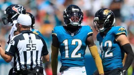 Jacksonville Jaguars wide receiver Travis Hunter (12) reacts to a tackle during the second quarter of an NFL football matchup at EverBank Stadium, Sunday, Sept. 21, 2025, in Jacksonville, Fla. The Jaguars defeated the Texans 17-10.