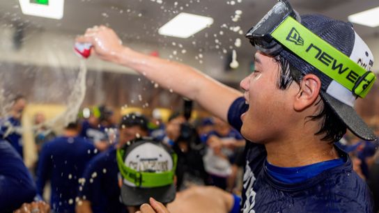 Los Angeles Dodgers designated hitter Shohei Ohtani (17) celebrates with his team after clinching the National League title against the Arizona Diamondbacks at Chase Field. Los Angeles Dodgers designated hitter Shohei Ohtani (17) celebrates with his team after clinching the National League title against the Arizona Diamondbacks at Chase Field.