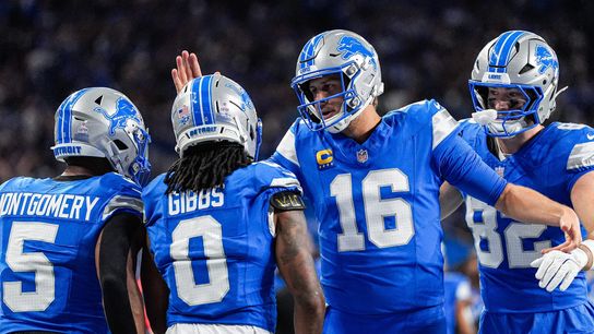 Detroit Lions quarterback Jared Goff (16) celebrates a touchdown scored by running back Jahmyr Gibbs (0) against Cleveland Browns during the first half at Ford Field in Detroit on Sunday, Sept. 28, 2025.
