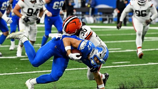 Sep 28, 2025; Detroit, Michigan, USA; Detroit Lions tight end Sam LaPorta (87) is tackled by Cleveland Browns linebacker Devin Bush (30) during the second half at Ford Field.