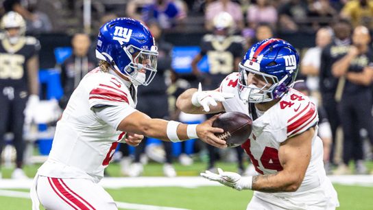 Oct 5, 2025; New Orleans, Louisiana, USA; New York Giants quarterback Jaxson Dart (6) hands off to running back Cam Skattebo (44) during the first half at Caesars Superdome.