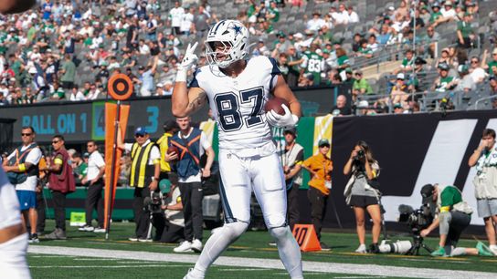 Oct 5, 2025; East Rutherford, New Jersey, USA; Dallas Cowboys tight end Jake Ferguson (87) reacts in the end zone after catching his second touchdown pass of the game against the New York Jets during the first half at MetLife Stadium.