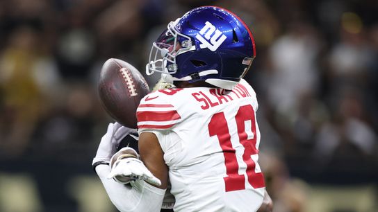 Oct 5, 2025; New Orleans, Louisiana, USA; New York Giants wide receiver Darius Slayton (18) reaches for the ball against New Orleans Saints cornerback Isaac Yiadom (26) during the first half at Caesars Superdome. 