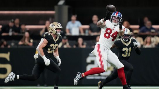 Oct 5, 2025; New Orleans, Louisiana, USA; New York Giants tight end Theo Johnson (84) catches a pass against New Orleans Saints linebacker Pete Werner (20) at Caesars Superdome.