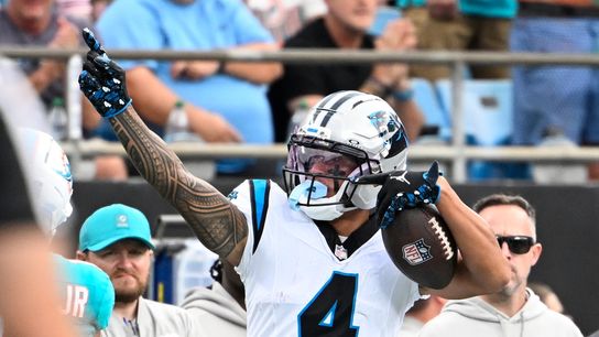 Oct 5, 2025; Charlotte, North Carolina, USA; Carolina Panthers wide receiver Tetairoa McMillan (4) signals first down in the second quarter at Bank of America Stadium.