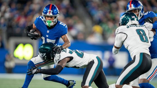 New York Giants wide receiver Wan'Dale Robinson (17) catches a pass before being tackled by Philadelphia Eagles cornerback Quinyon Mitchell (27) during a Thursday Night Football game between the New York Giants and the Philadelphia Eagles at MetLife Stadium in East Rutherford on Oct. 9, 2025.