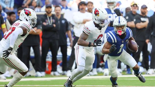Oct 12, 2025; Indianapolis, Indiana, USA; Indianapolis Colts wide receiver Josh Downs (1) carries the ball defended by Arizona Cardinals cornerback Will Johnson (0) during the first quarter of the game at Lucas Oil Stadium.