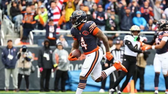 Oct 19, 2025; Chicago, Illinois, USA; Chicago Bears running back D'Andre Swift (4) rushes the ball for a touchdown against the New Orleans Saints during the second quarter at Soldier Field.