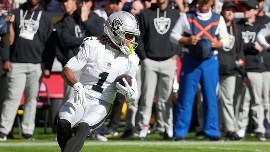 Caption: Oct 19, 2025; Kansas City, Missouri, USA; Las Vegas Raiders wide receiver Tre Tucker (1) carries the ball against the Kansas City Chiefs during the fourth quarter of the game at GEHA Field at Arrowhead Stadium. 