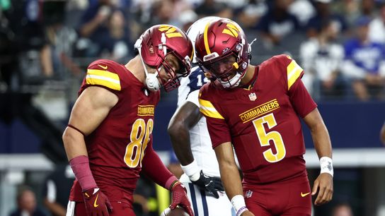 Oct 19, 2025; Arlington, Texas, USA; Washington Commanders tight end Zach Ertz (86) and quarterback Jayden Daniels (5) celebrate after scoring a touchdown against the Dallas Cowboys during the first quarter of the game at AT&T Stadium.