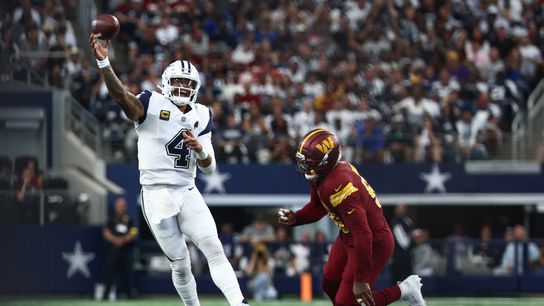 Oct 19, 2025; Arlington, Texas, USA; Dallas Cowboys quarterback Dak Prescott (4) scrambles against under pressures from Washington Commanders defensive end Jacob Martin (55) during the first quarter of the game at AT&T Stadium.