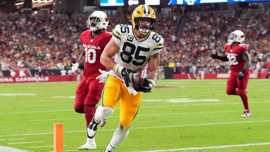 Oct 19, 2025; Glendale, Arizona, USA; Green Bay Packers tight end Tucker Kraft (85) scores a touchdown against the Arizona Cardinals during the second half at State Farm Stadium