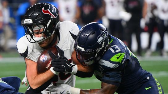 Oct 20, 2025; Seattle, Washington, USA; Seattle Seahawks linebacker Ernest Jones IV (13) tackles Houston Texans tight end Dalton Schultz (86) during the second quarter at Lumen Field.