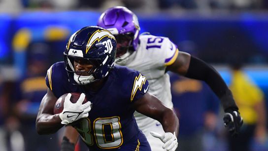 Oct 23, 2025; Inglewood, California, USA; Los Angeles Chargers running back Kimani Vidal (30) rushes the ball against the Minnesota Vikings during the second half at SoFi Stadium. 