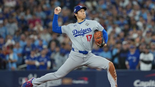 Los Angeles Dodgers starting pitcher Shohei Ohtani (17) throws pitch against the Toronto Blue Jays in the first inning for game seven of the 2025 MLB World Series at Rogers Centre. 