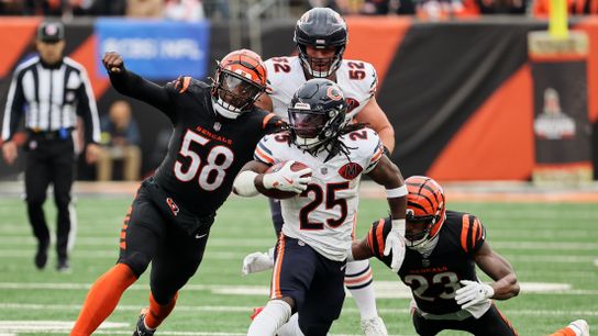 Nov 2, 2025; Cincinnati, Ohio, USA; Chicago Bears running back Kyle Monangai (25) runs the ball against Cincinnati Bengals defensive end Joseph Ossai (58) and cornerback Dax Hill (23) during the third quarter at Paycor Stadium.