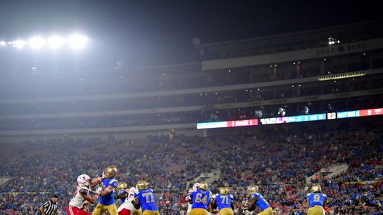 Nov 8, 2025; Pasadena, California, USA; UCLA Bruins running back Jaivian Thomas (21) runs the ball against the Nebraska Cornhuskers during the second half at the Rose Bowl. 
