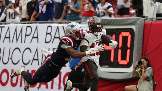 Nov 9, 2025; Tampa, Florida, USA; Tampa Bay Buccaneers wide receiver Tez Johnson (15) catches a pass for a touchdown under pressure from New England Patriots safety Craig Woodson (31) during the fourth quarter at Raymond James Stadium. Nov 9, 2025; Tampa, Florida, USA; Tampa Bay Buccaneers wide receiver Tez Johnson (15) catches a pass for a touchdown under pressure from New England Patriots safety Craig Woodson (31) during the fourth quarter at Raymond James Stadium.