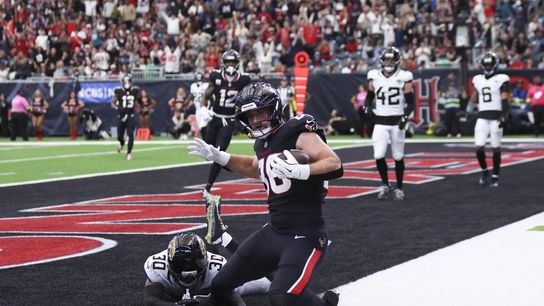 Nov 9, 2025; Houston, Texas, USA; Houston Texans tight end Dalton Schultz (86) scores a touchdown as Jacksonville Jaguars cornerback Montaric Brown (30) defends during the second half at NRG Stadium. Nov 9, 2025; Houston, Texas, USA; Houston Texans tight end Dalton Schultz (86) scores a touchdown as Jacksonville Jaguars cornerback Montaric Brown (30) defends during the second half at NRG Stadium.