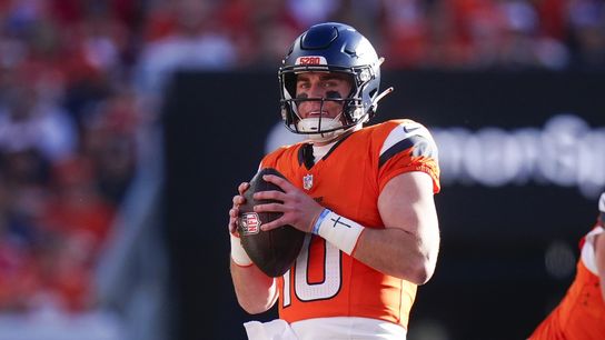 Nov 16, 2025; Denver, Colorado, USA; Denver Broncos quarterback Bo Nix (10) looks to pass during the first quarter of the game against the Kansas City Chiefs at Empower Field at Mile High.