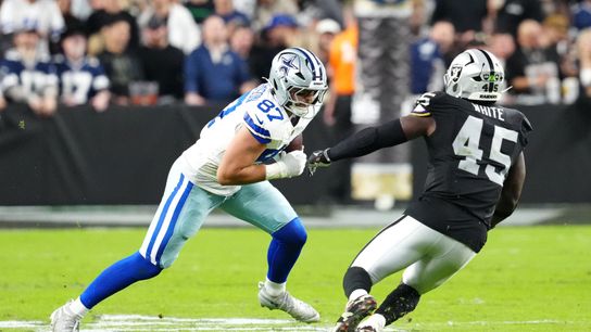 Nov 17, 2025; Paradise, Nevada, USA; Dallas Cowboys tight end Jake Ferguson (87) carries the ball against Las Vegas Raiders linebacker Devin White (45) during the second half at Allegiant Stadium.
