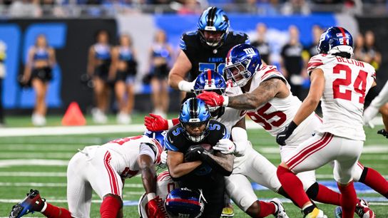 Nov 23, 2025; Detroit, Michigan, USA; Detroit Lions running back David Montgomery (5) is tackled after a short pass in the second quarter against the New York Giants at Ford Field.