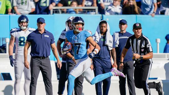 Tennessee Titans wide receiver Chimere Dike (17) runs back a punt for a touchdown during the third quarter against the Seattle Seahawks at Nissan Stadium in Nashville, Tenn., Sunday, Nov. 23, 2025.