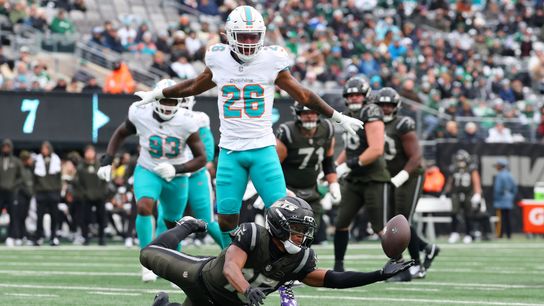 Dec 7, 2025; East Rutherford, New Jersey, USA; New York Jets wide receiver Adonai Mitchell (15) dives for the ball against the Miami Dolphins during the first half at MetLife Stadium. Dec 7, 2025; East Rutherford, New Jersey, USA; New York Jets wide receiver Adonai Mitchell (15) dives for the ball against the Miami Dolphins during the first half at MetLife Stadium.