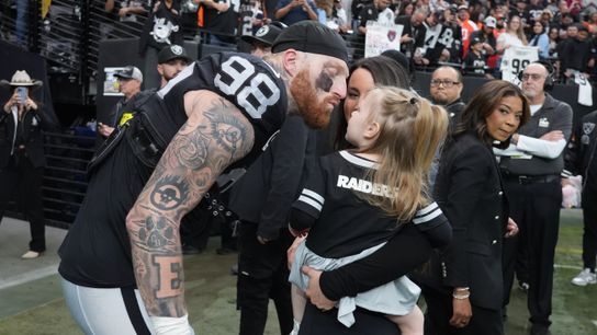 Maxx Crosby and Ella Rose steal hearts in green during recovery taken at Las Vegas (Las Vegas Raiders)