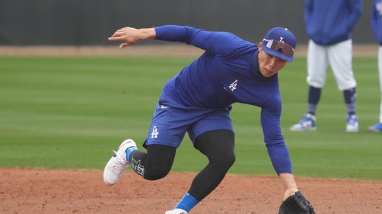 Los Angeles Dodgers second baseman Hyeseong Kim (6) fields the ball during spring training camp. 