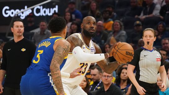 Los Angeles Lakers forward LeBron James (23) is defended by Golden State Warriors guard Will Richard (3) in the first period at Chase Center. 