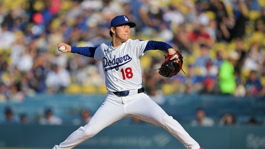 Los Angeles Dodgers pitcher Yoshinobu Yamamoto (18) pitches during the first inning against the Cleveland Guardians at Dodger Stadium.