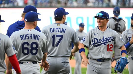 Los Angeles Dodgers left fielder Alex Call (12) and designated hitter Shohei Ohtani (17) react after defeating the Washington Nationals at Nationals Park. 